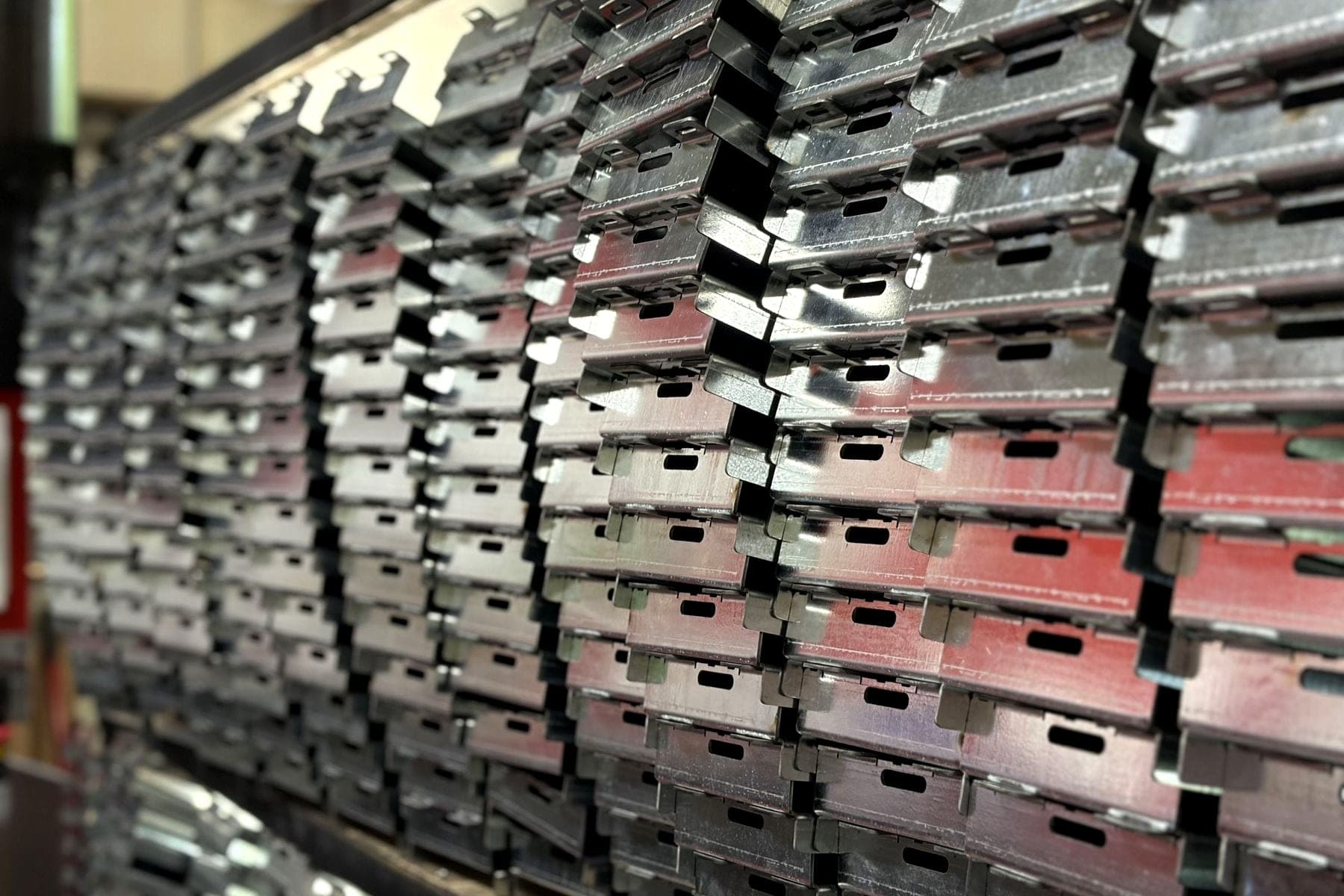 Racks of formed and zinc-coated production parts stacked for delivery
