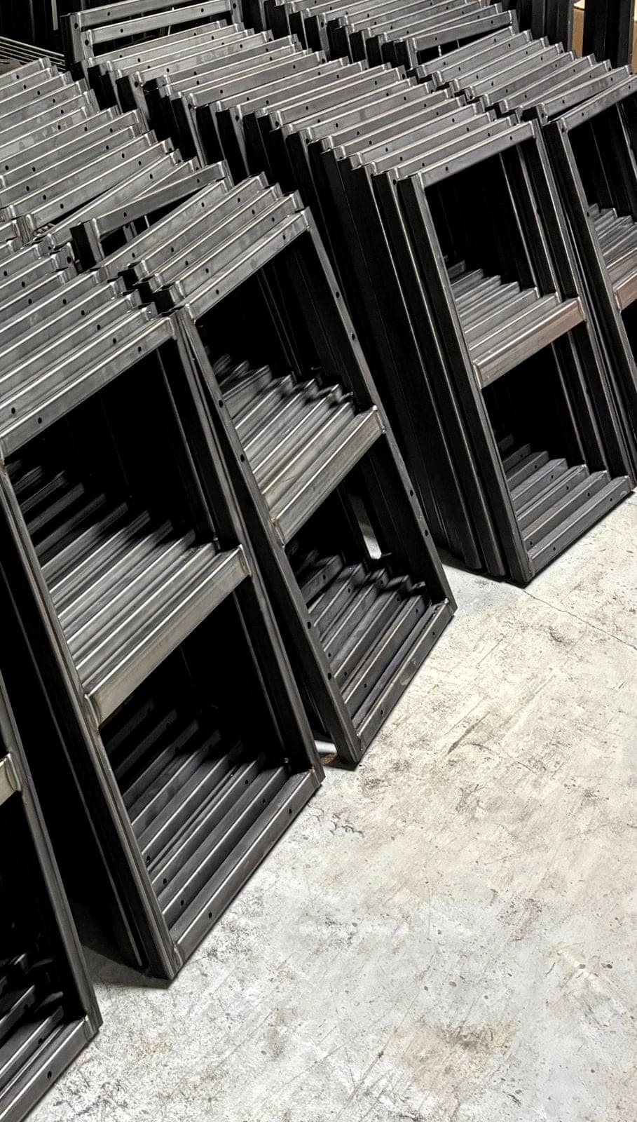 Raw formed frames stacked mid-production