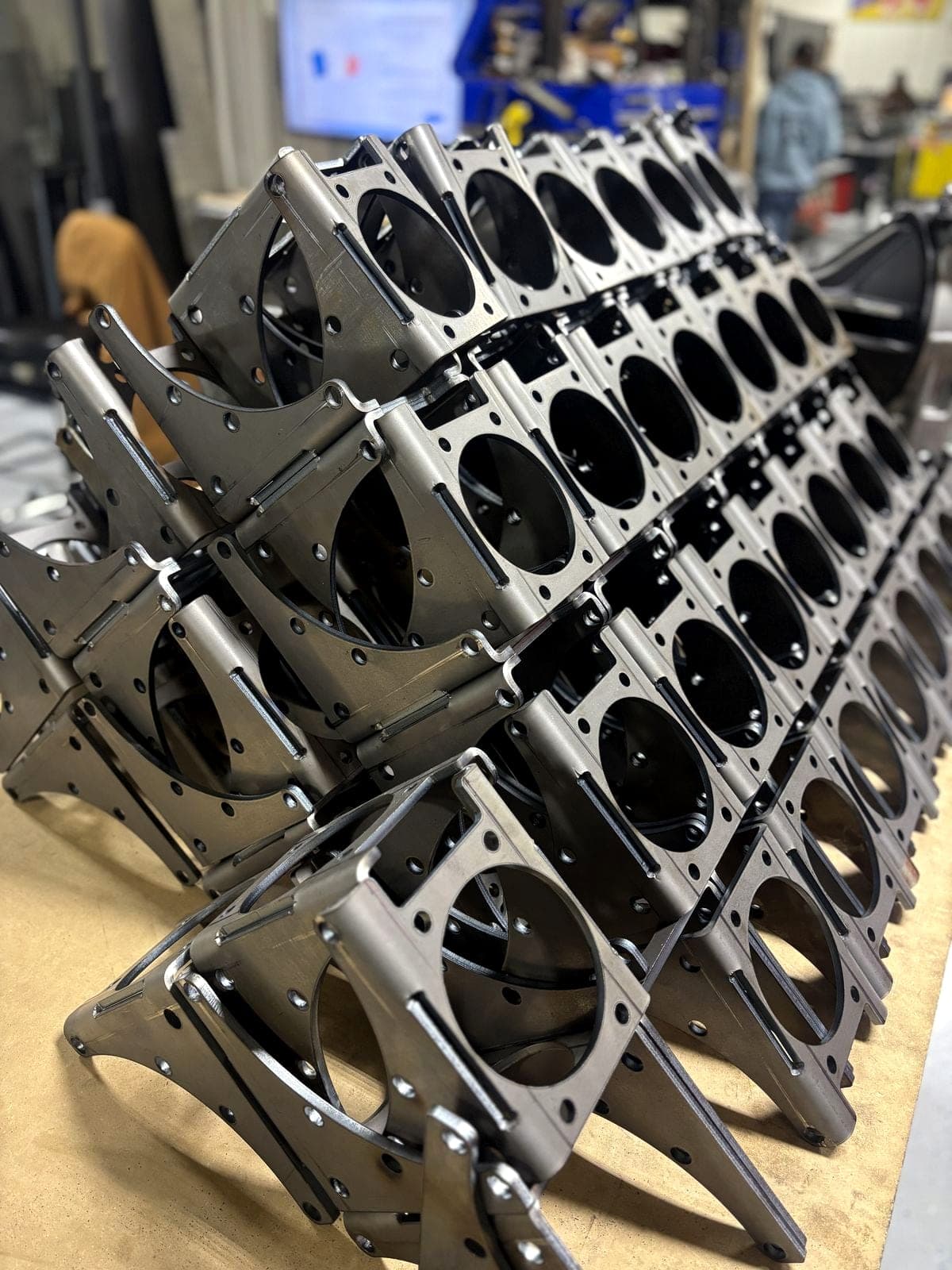 Bent steel covers stacked fresh off the press brake